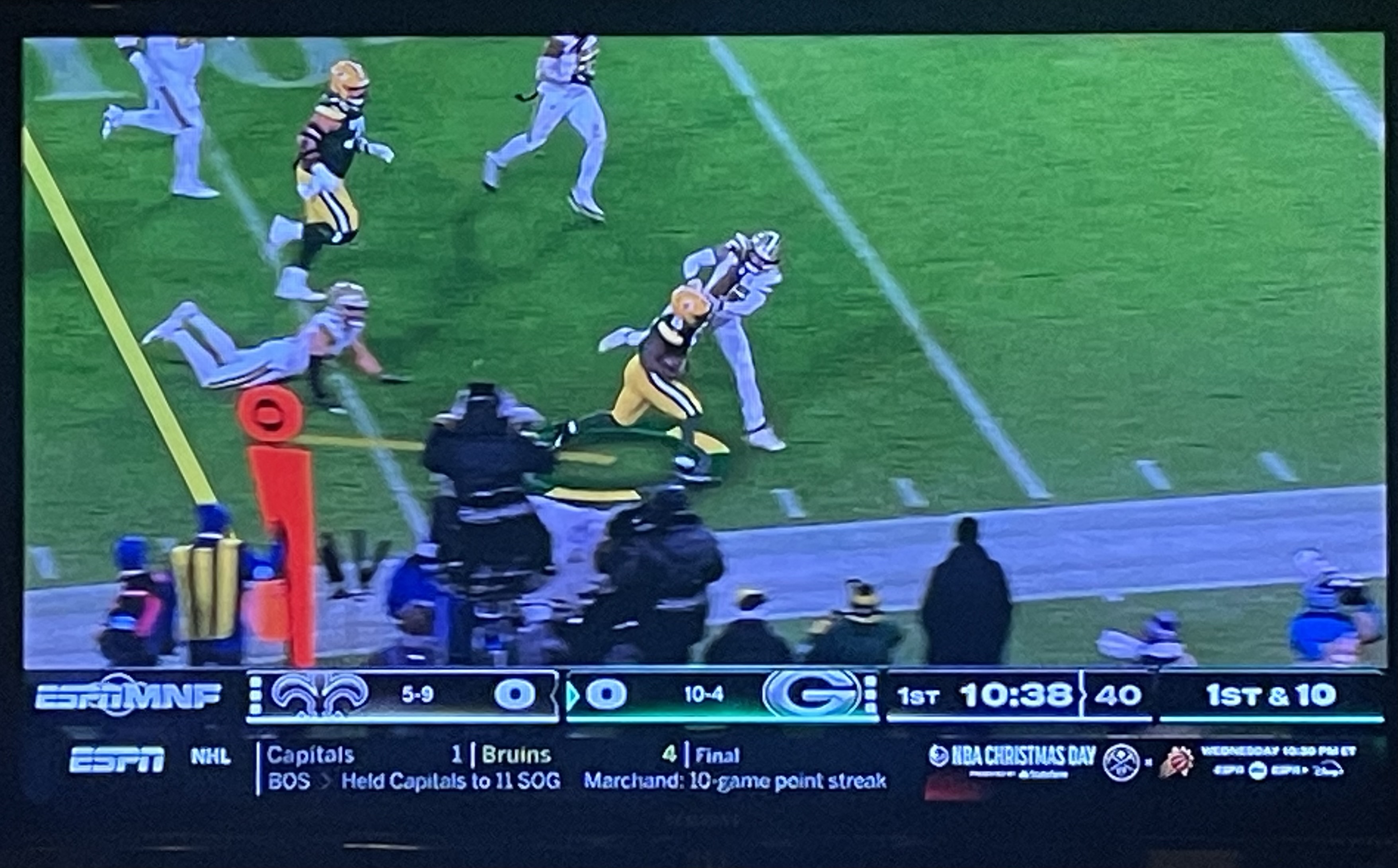 Jacobs delivers the stiff arm.